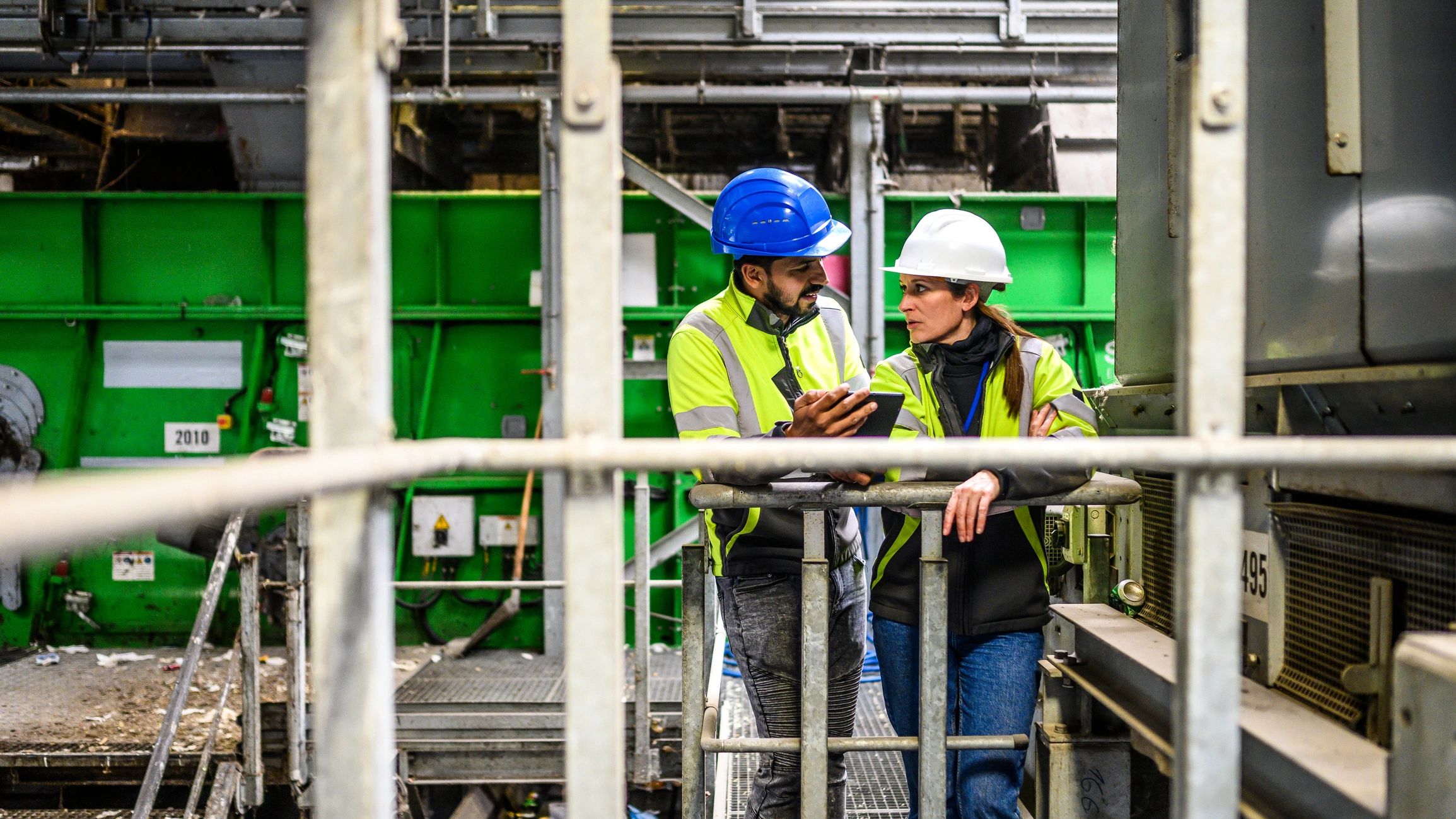 Technology professionals reviewing operational data